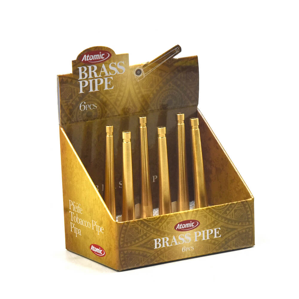 Displaydoos met zes goudkleurige messing pijpjes van Atomic Brass Pipe, ideaal voor discreet en stijlvol roken.